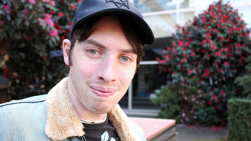 Ricky Meerding of Hobart, sitting on a park bench.