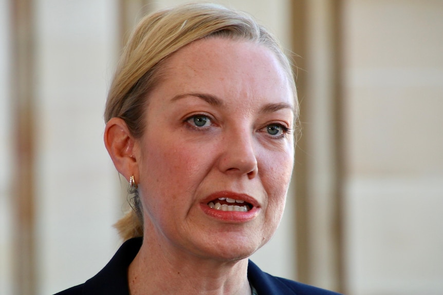 A close-up of Mia Davies outside parliament.