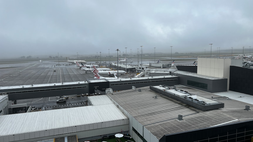 Melbourne airport runway in fog.