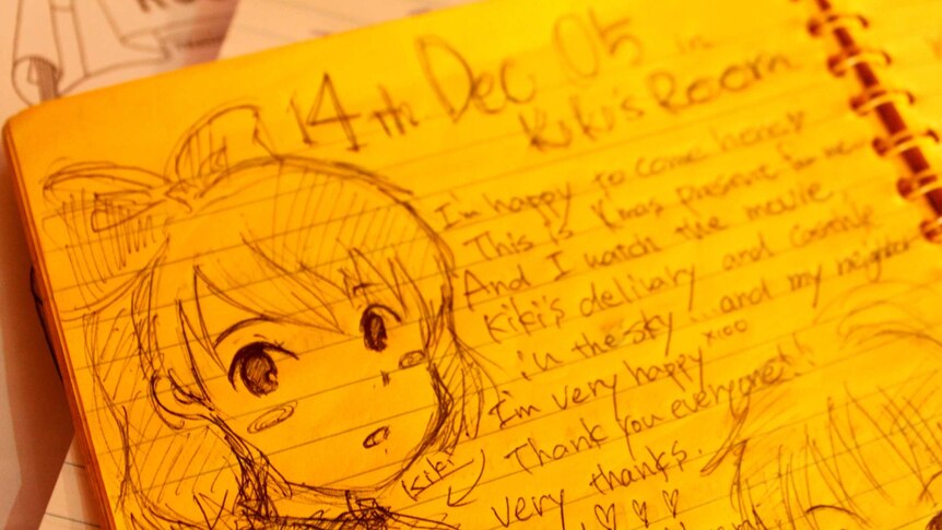 Kiki's face drawn onto the guest book inside the bakery's tribute room.