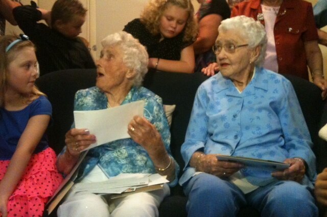 100 year old Perth twins Flora Barrett and Winifred Hopes celebrating with family and friends.