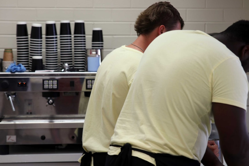 Banksia Beans Cafe staff making coffees.