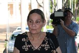 Sandra Kitching walks into Darwin's Supreme Court to give evidence at the Royal Commission
