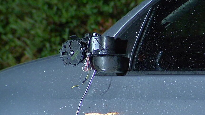The side mirror has been smashed off the damaged side of the silver Volkswagen Golf.