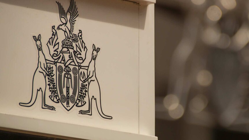 The Northern Territory coat of arms outside the NT Parliament.