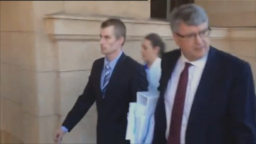 Brock Powell walked from court with his lawyer