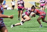 Redfern All Blacks women's rugby league player on the field