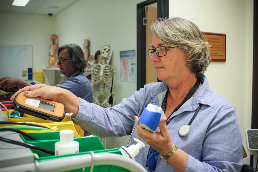 Dr Isabelle Skinner sorting out medical equipment at a clinic in Mount Isa.