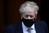 British Prime Minister Boris Johnson walks outside Downing Street.