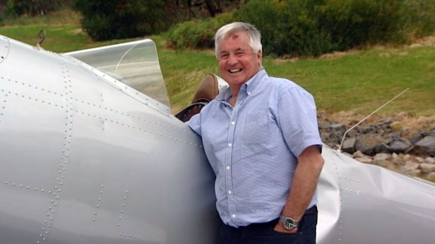 Graham Hosking with the plane that made a safe crash landing in Melbourne