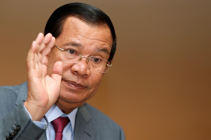Hun Sen looks like he's waving