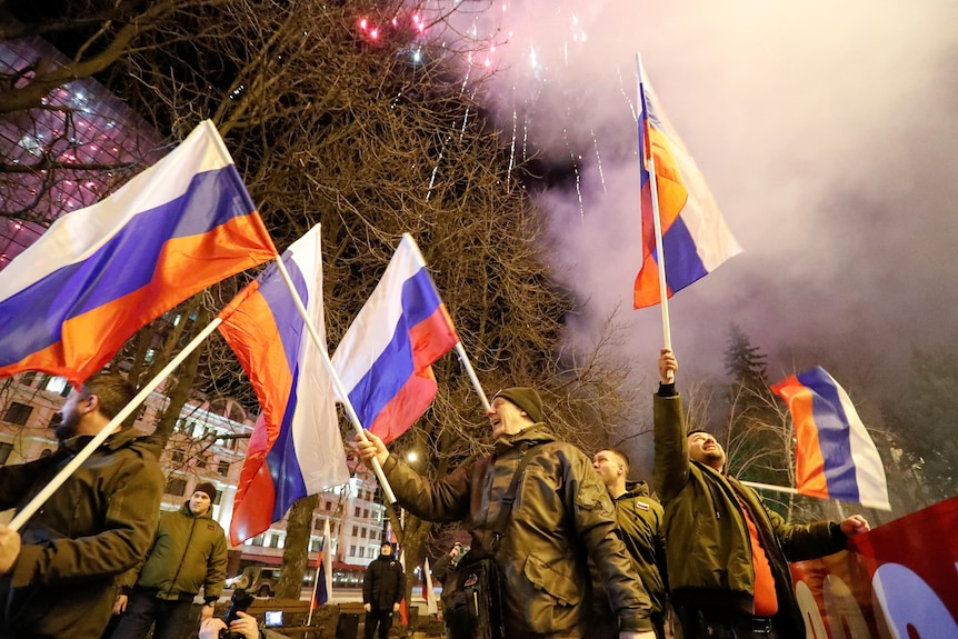 People wave flags.