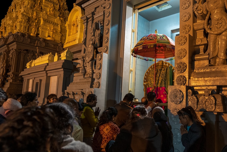 Crowds outside the Shri Shiva Vishnu temple.