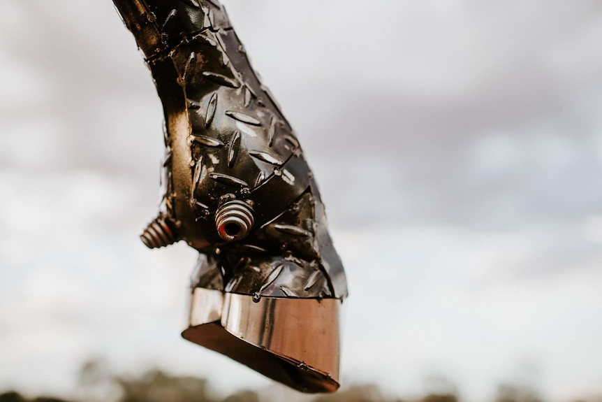 The hoof of the bullock welded together with scraps of metal.