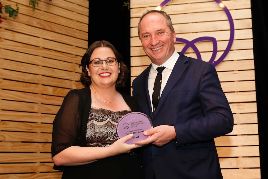 Tanya Dupagne poses with Deputy Prime Minister Barnaby Joyce after receiving her award.