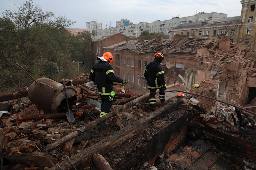 Emergency workers search for victims after a Russian air attack.