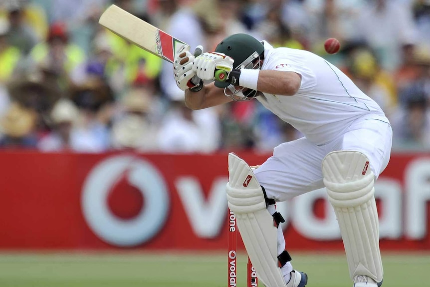 Ouch... Jacques Kallis feels the pain in his hamstring as he ducks a bouncer.