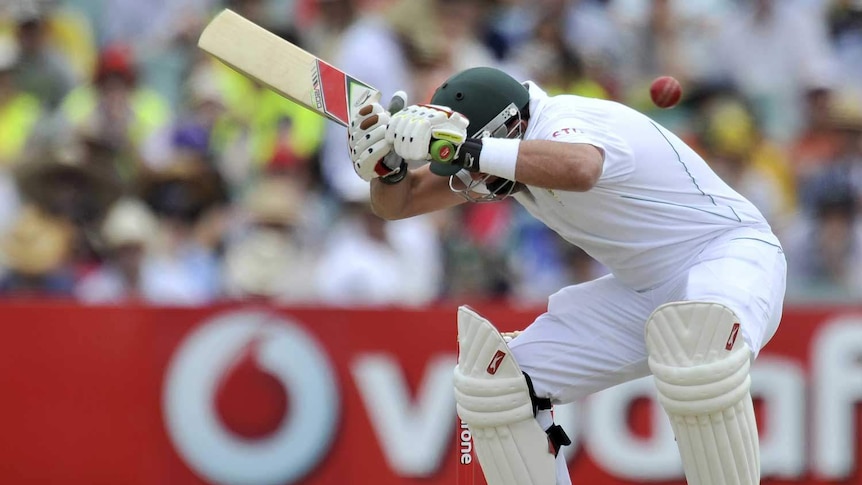 Ouch... Jacques Kallis feels the pain in his hamstring as he ducks a bouncer.