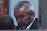 Borce Ristevski is led into court to be sentenced.
