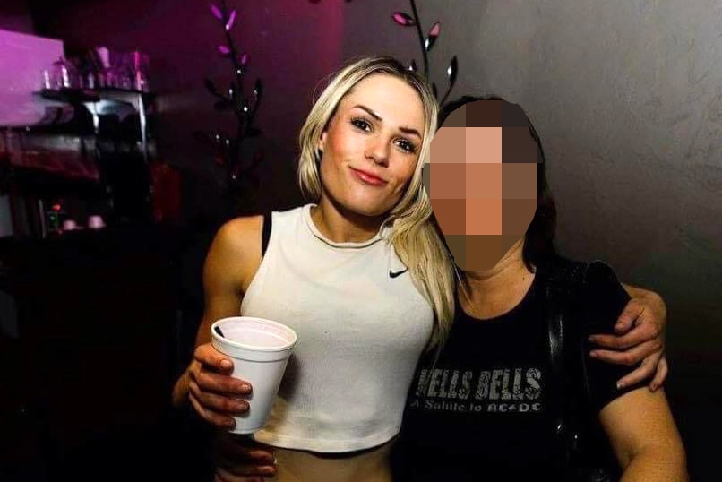 A woman with her arm around another woman whose face is pixellated.