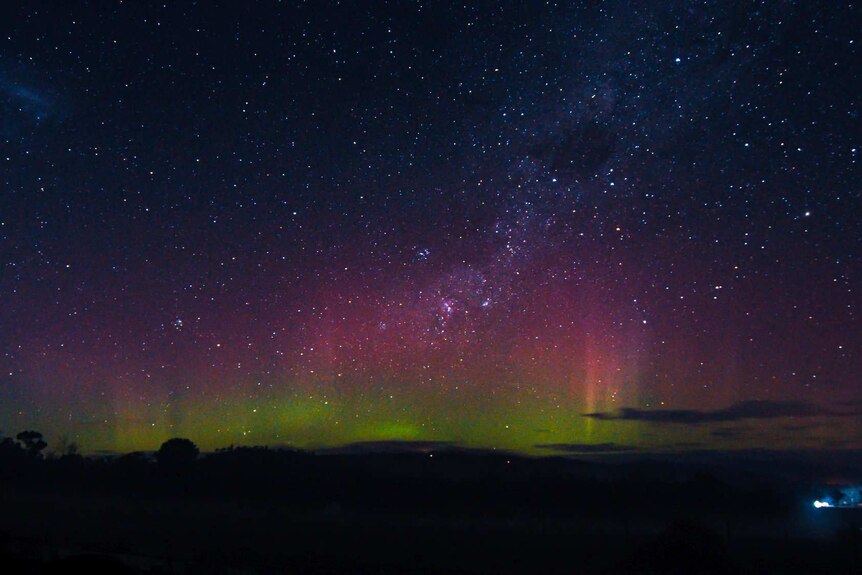 Green and pink in a starry sky in Exeter, Tasmania.