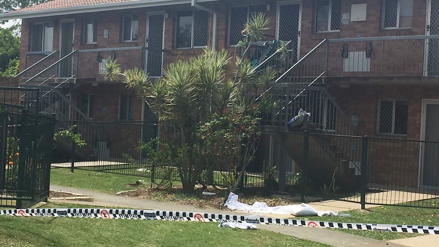 Crime scene with police tape around a unit in Bergin Street at Booval at Ipswich.