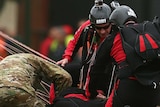 Downed parachutist is attended to at SCG