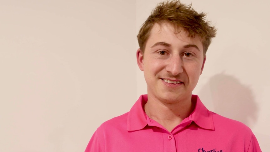 Jacob Cooper wearing fluro pink polo shirt 