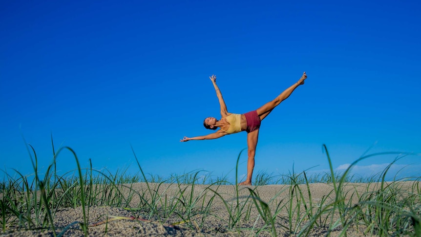 Lara practising Half Moon pose, featured in this balance sequence.