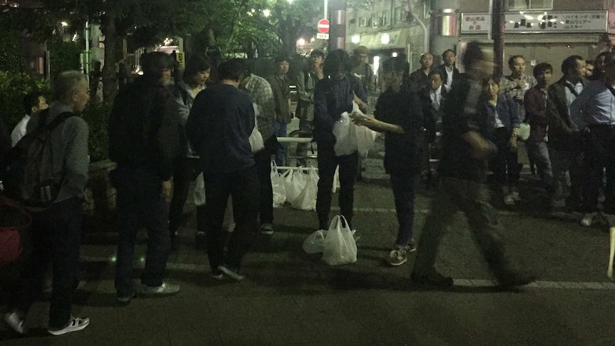 People line up for food.