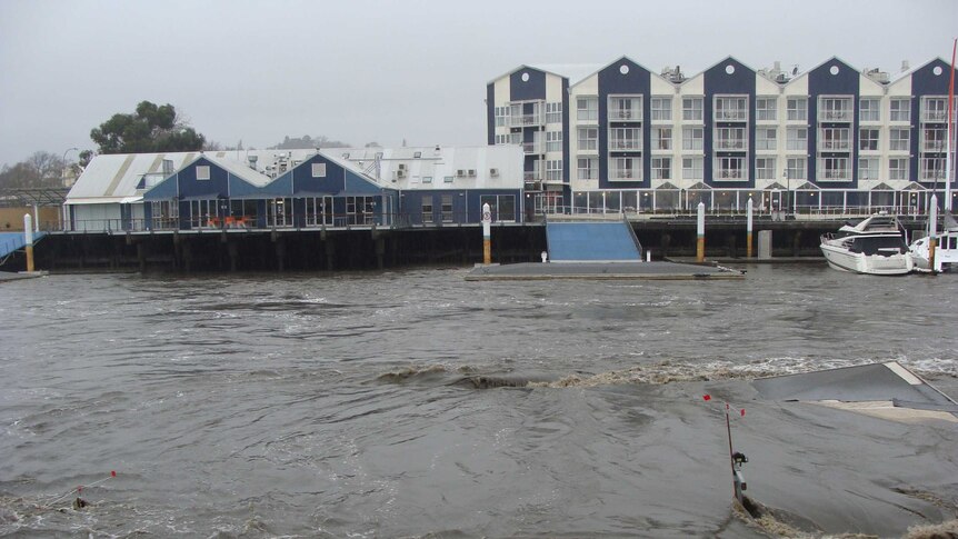 The pontoon of the North Esk Rowing Club in Launceston becomes submerged.