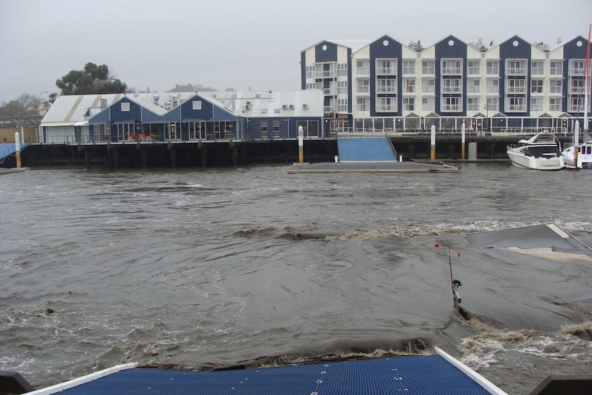 The pontoon of the North Esk Rowing Club in Launceston becomes submerged.