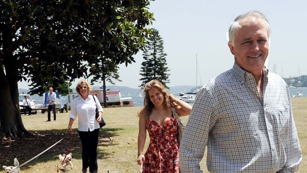 Malcolm Turnbull, his daughter Daisy and wife Lucy take their dogs for a walk