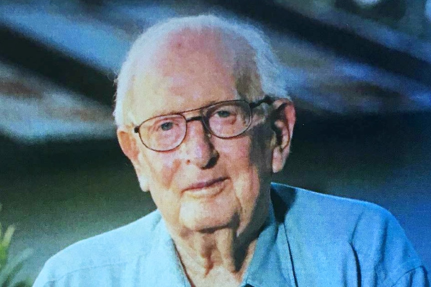 An elderly man in a photograph