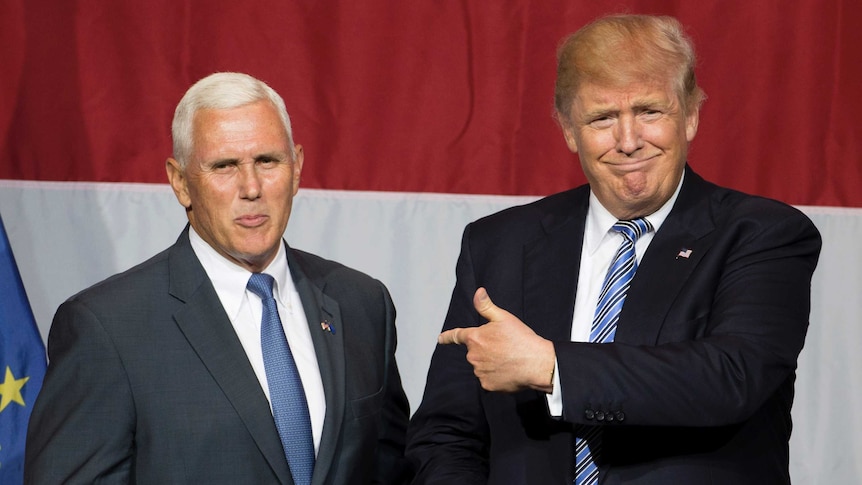 US Republican presidential candidate Donald Trump (R) and Indiana Governor Mike Pence (L).