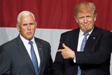 US Republican presidential candidate Donald Trump (R) and Indiana Governor Mike Pence (L).