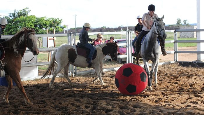 Riders at the Hughenden Pony Club in north-west Qld play 'horse soccer'.