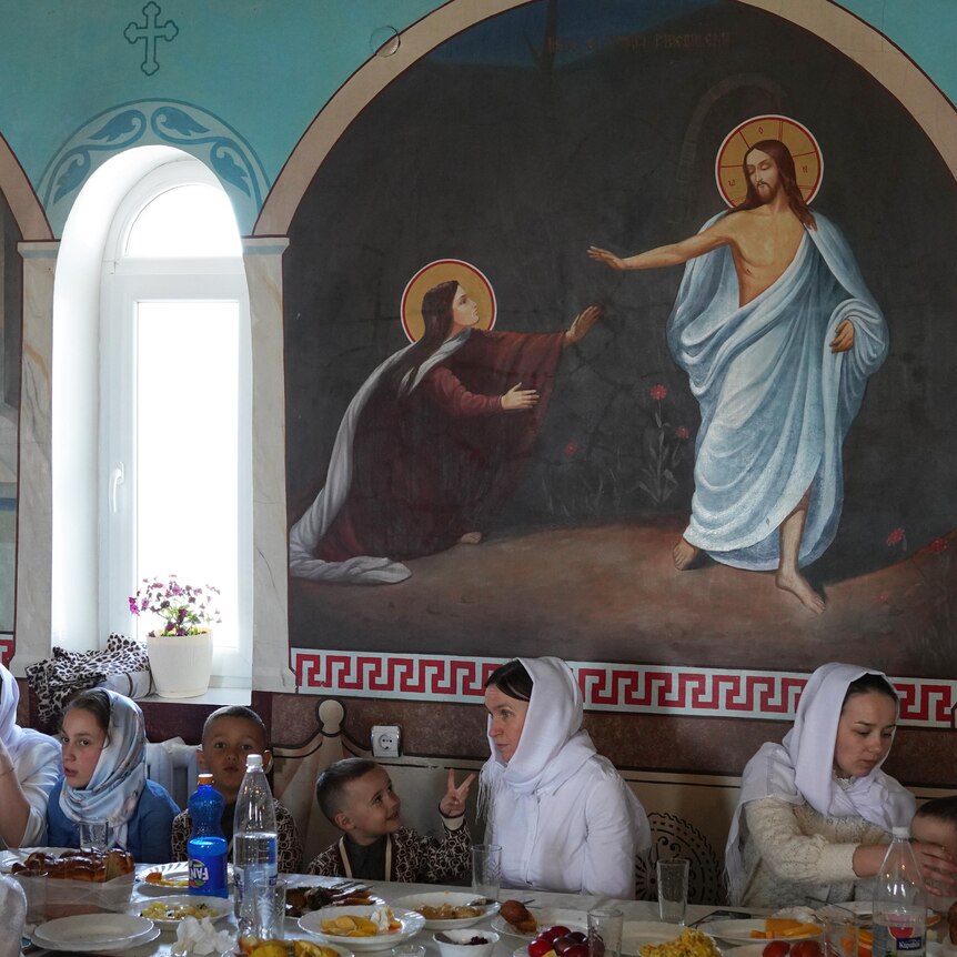 Women and children gather for lunch in a Ukrainian monastery