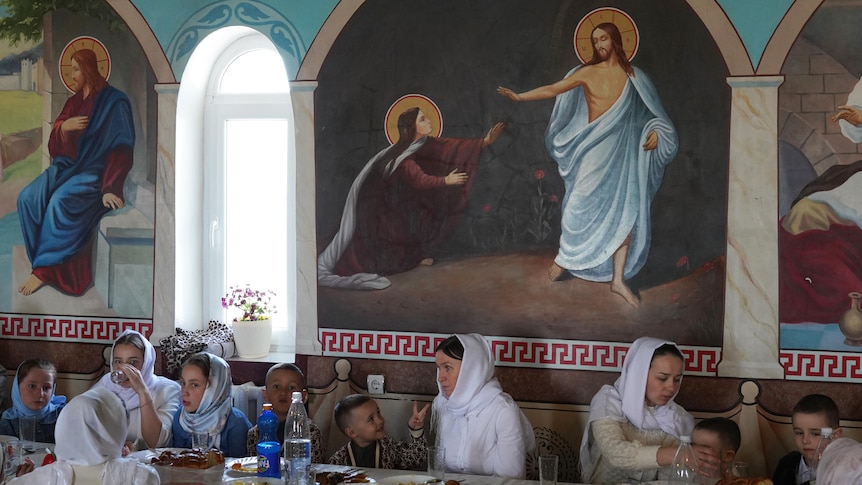 Women and children gather for lunch in a Ukrainian monastery