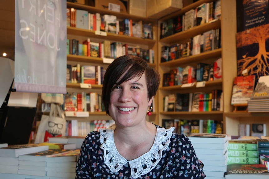 Sarah Rakich sitting in book store Beaufort St Books