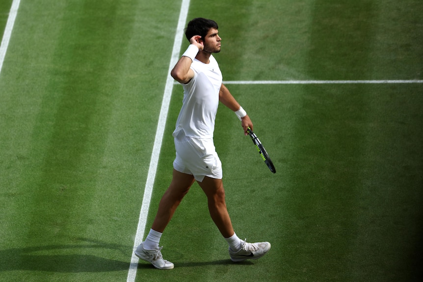 Carlos Alcaraz of Spain celebrates winning the second set during Wimbledon tennis match. 