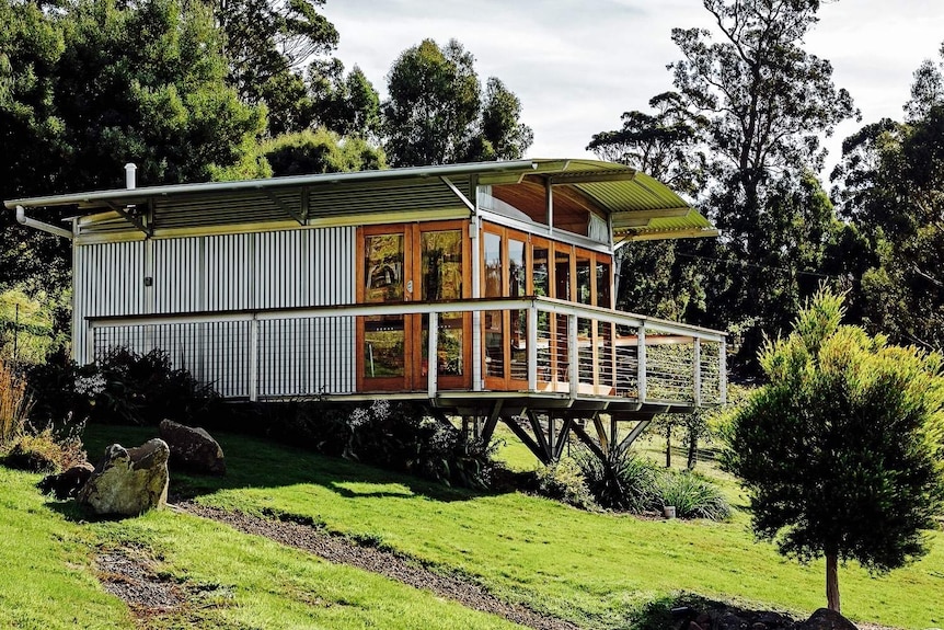 A small tourism dwelling at the edge of a forest.