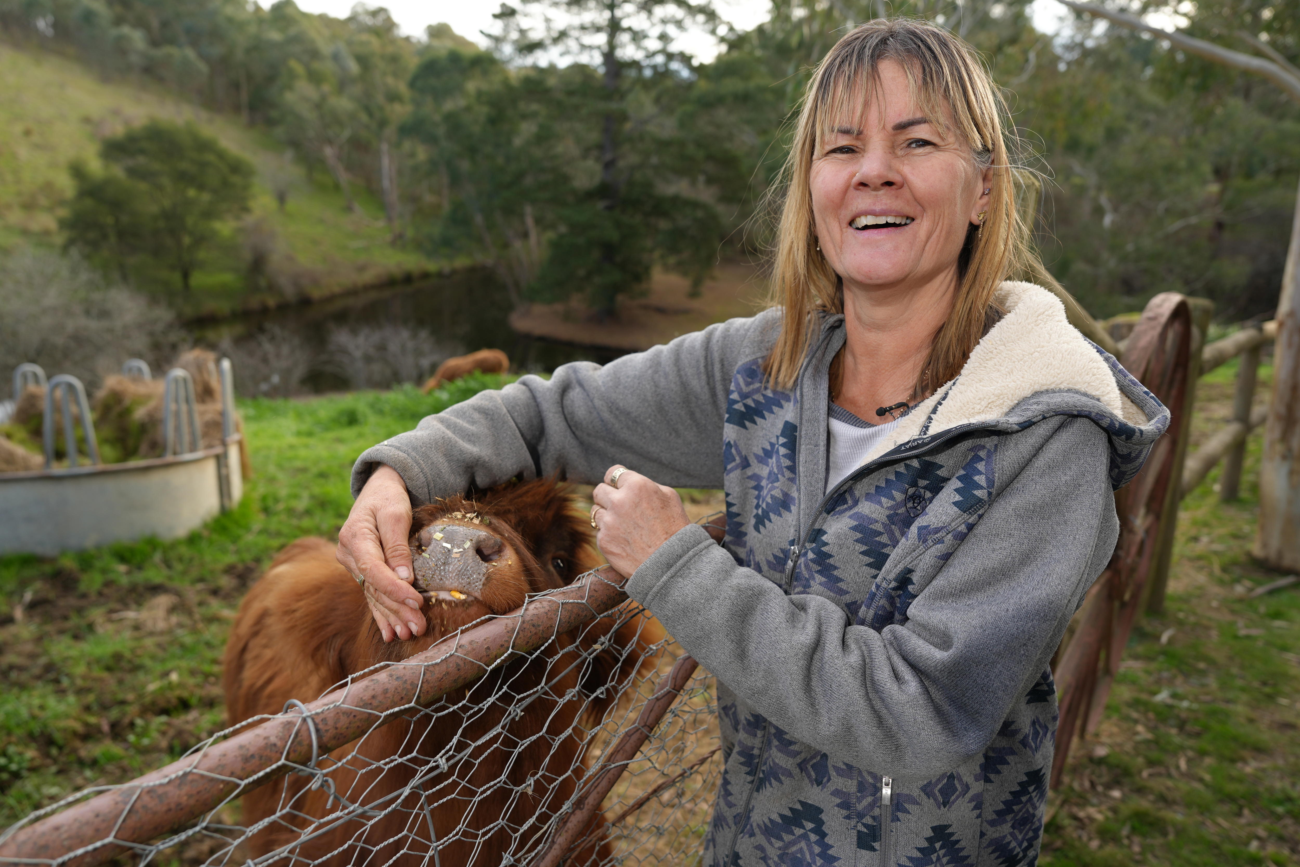 Leanne Winter at the fence on her property in 