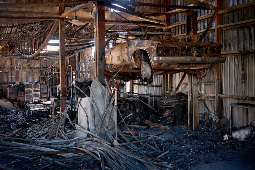 Charred remains of Kerry Kyriacou's joinery business after a fire gutted the building in the industrial area of Woolner.