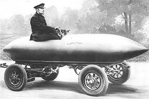 A black and white illustration of a man in a hat perched in a torpedo-shaped car