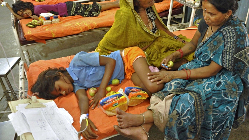 Sick school children recuperate in a Patna hospital ward in India