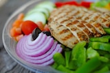 Lean meat and salad on a plate.