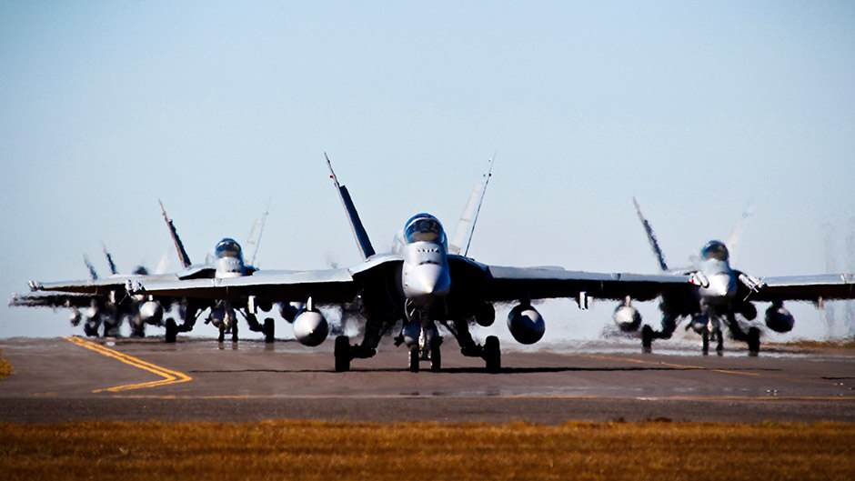 F/A-18A Hornets taxi to RAAF Base Darwin's runway during Exercise Pitch Black 2014.