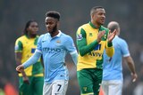 Manchester City's Raheem Sterling looks on as Norwich's Martin Olsson applauds