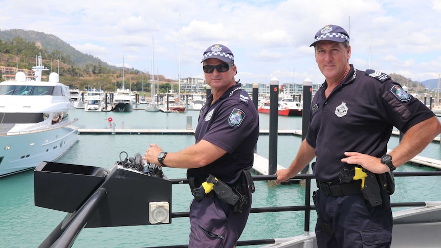 Two police officers on a boat
